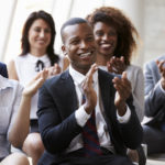 Audience Applauding Speaker At Business Conference